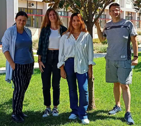 A group of people posing for a photo Description automatically generated